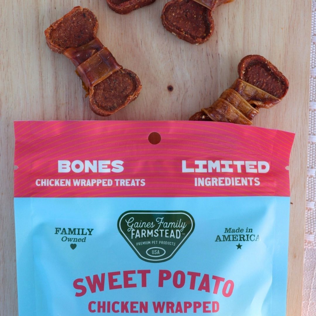 Chicken wrapped sweet potato bones arranged above their bag