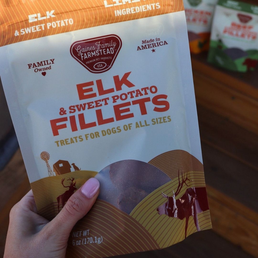 Hand holding a bag of elk and sweet potato fillets