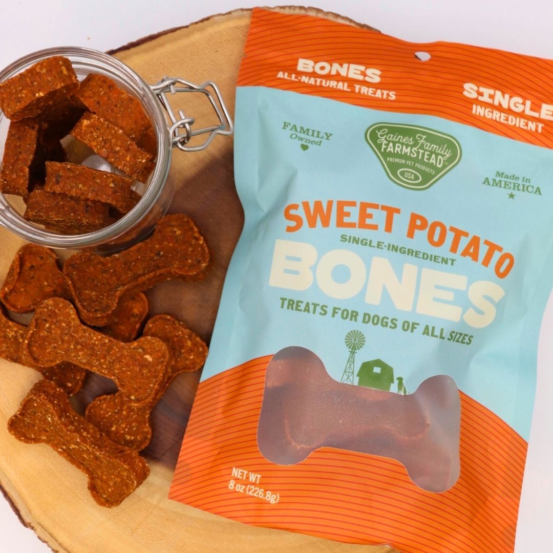 Sweet potato bones beside their bag and an open treat jar